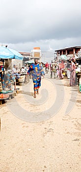 How African  women hustle on the street to cater for their children in African Market