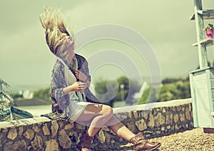 This is how bohemians brush their hair. a bohemian young woman spending a summer day outside.