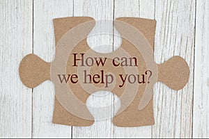 How can we help you text on a cardboard puzzle piece