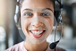 How can I be of help. Cropped portrait of an attractive young woman working in a call center.