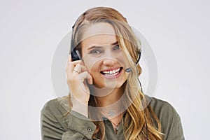 How can I be of service. Studio portrait of an attractive young female customer service representative wearing a headset