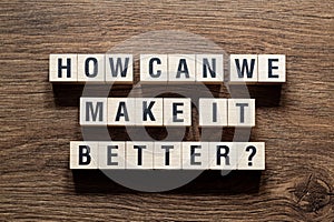 How can we make it better - word concept on building blocks, text