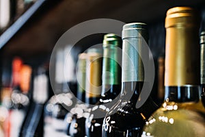 How choose wine. Assorted Wine Bottles on Display in a Store. A selective focus labels of a variety of wine bottles on a