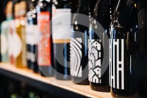 How choose wine. Assorted Wine Bottles on Display in a Store. A selective focus labels of a variety of wine bottles on a