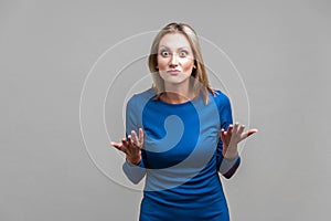 How could you? Portrait of disappointed unhappy woman asking what do you want. indoor studio shot isolated on gray background