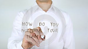 How Do You Motivate your Team, Businessman Writing on Glass