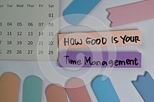 How Good is Your Time Management write on sticky notes isolated on office desk