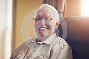 How has my life been Sofa so good. Cropped portrait of a happy senior man relaxing on the sofa at home.