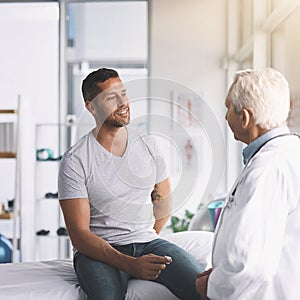 How an I doing, doc. a senior doctor giving his male patient a thorough checkup during his consultation.