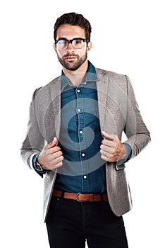 This is how I dress for the office. Studio shot of a handsome young man posing against a white background.