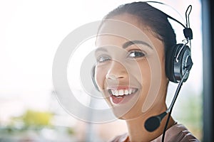 How may I direct your call. Cropped portrait of an attractive young woman working in a call center.