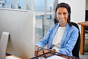 How may I help you. Portrait of an attractive young female call center operator.