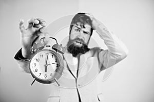 How much time left till deadline. Time to work. Man bearded stressful businessman hold clock. Stress concept. Hipster