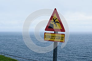 How painful is falling off a cliff. warning sign
