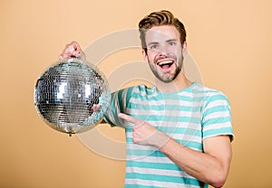 How about party. Handsome man hold disco ball. Disco dances night club. Retro music. Guy inviting you at party. Thousand