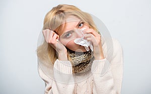 How to bring fever down. Girl sick hold thermometer and tissue. Measure temperature. Break fever remedies. Seasonal flu