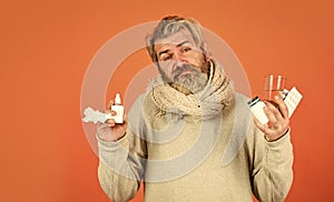How to bring fever down. man ready to take a pill. ill man at home. sneezing and coughing. man got flu, having runny