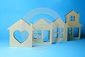 How to choose a house. Different houses with windows on blue background. Wooden house with heart