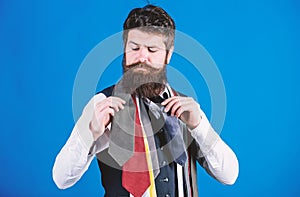 How to choose right tie. Classic style. How to match necktie with shirt and suit. Man bearded hipster hold few neckties