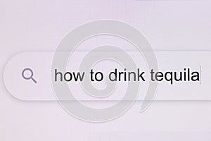 How to drink tequila - pc screen internet browser search engine bar typing alcohol related question. Typing the word How