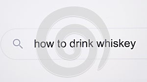 How to drink whiskey - pc screen internet browser search engine bar typing alcohol related question. Typing the word How