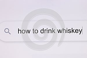 How to drink whiskey - pc screen internet browser search engine bar typing alcohol related question. Typing the word How
