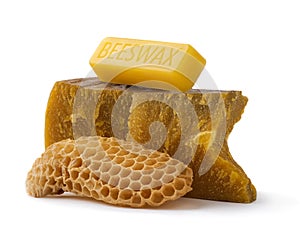 How to get natural organic beeswax. Pieces of organic beeswax on a white background. The use of beeswax in apitherapy