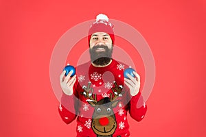 How to handle top holiday stress triggers. Hipster smiling cheerful bearded man wear winter sweater and hat hold balls