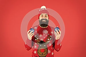 How to handle top holiday stress triggers. Hipster smiling cheerful bearded man wear winter sweater and hat hold balls