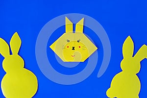 How to make a bunny at home. Craft for Easter. Step-by-step instruction. Step 8. Take colored paper. A simple creative idea with