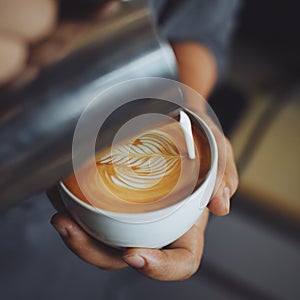 How to make coffee latte art by barista in vintage color tone