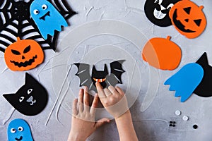 How to make decore for Halloween greetings and fun. Children art project. DIY concept. Step by step photo instruction