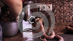 How to make sausage links with meat grinder. Woman use kitchenaid electric meat grinder. keto diet sausages from minced