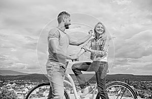 How to meet girls while riding bike. Man with beard and shy blonde lady on first date. Couple just meet to become