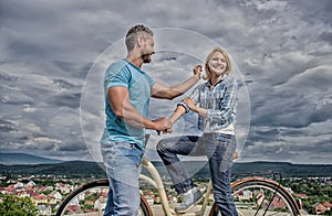 How to meet girls while riding bike. Man with beard and shy blonde lady on first date. Couple just meet to become