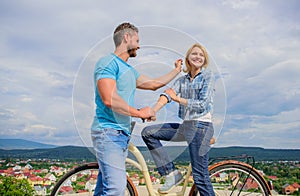 How to meet girls while riding bike. Man with beard and shy blonde lady on first date. Couple just meet to become