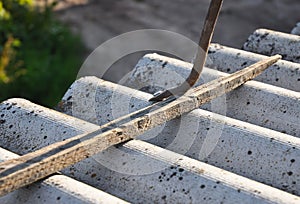 How to pull out the nails correctly from asbestos old roof tile