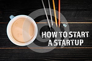 How to Start a Startup. Black textured wooden background