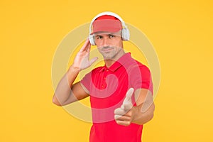 How about you. Guy point finger yellow background. Handsome man listen to music. Stereo sound technology. Technology and