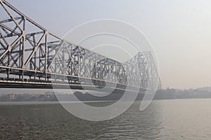 Howrah Bridge in a foggy morning photo