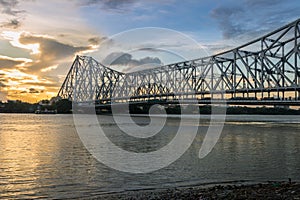 Howrah Bridge on the river Ganges (also known as the river Hooghly) at sunset. Photograph taken from Mallick ghat.