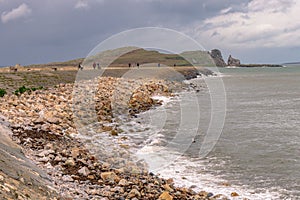 The Small Island of Irelands Eye of In the Irish Sea off Howth Near Dublin Ireland.Also part of the sea wall at Howth Harbour