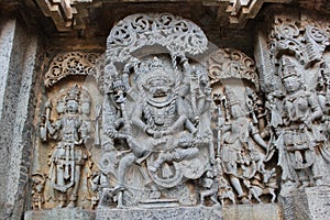 Hoysaleshwara Temple wall carving of Lord Narasimha killing the demon