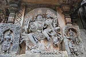Hoysaleshwara Temple wall carving of Lord Shiva and Parvati god and goddess carving