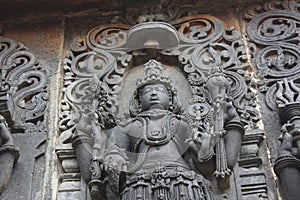 Hoysaleswara Temple Sculpture of Lord Vishnu with Shankh conch and Chakra spiral weapon