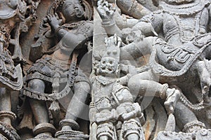 Hoysaleswara Temple wall carving of lord narasimha lion faced hindu god scalping a demon