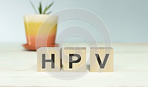 HPV Human Papillomavirus acronym on wooden