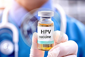 HPV vaccine vial close-up in hand of a medical professional, a vital immunization shot against the human papillomavirus