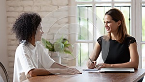 HR manager holding job interview with skilled african ethnicity woman.