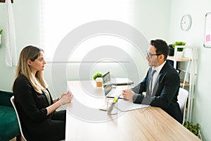 HR manager in a suit doing an interview with a woman